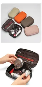 Genuine leather portable cosmetic bag, travel makeup organizer with multiple compartments.