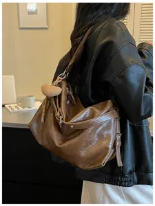 Brown oil wax leather shoulder bag, casual commuting slouchy crossbody bag for women.