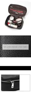 Genuine leather cosmetic travel bag detail showing litchi texture, zipper, and storage capacity.