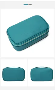 Detailed view of the portable leather cosmetic bag showing fine texture, zipper and shape.