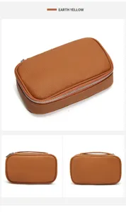 Detail view of the portable leather cosmetic bag showing fine texture and sturdy zipper.