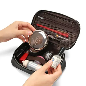 Portable genuine leather cosmetic bag with large capacity, multi-compartment travel makeup organizer.