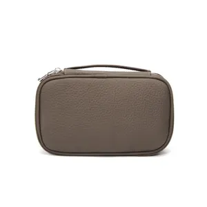 Genuine leather travel cosmetic bag portable makeup organizer with top handle and secure zipper.