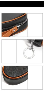 Details of black leather mini coin purse zipper and key ring pendant accessory closeup view.