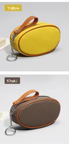 Mini oval leather coin purse with zipper closure, color-blocking handle and metal keychain.