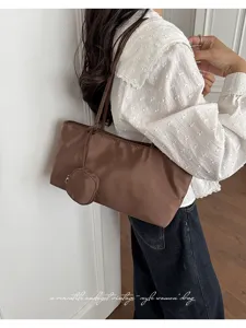 Brown nylon underarm shoulder bag with coin purse for women daily casual commute.