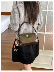 Korean style contrast color pillow shoulder bag with metal chain and fashion furry charm pendant.