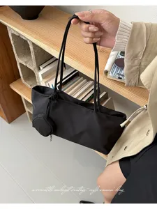 Minimalist black nylon underarm bag for women, stylish vintage shoulder bag with pouch.