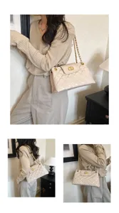 Beige quilted chain shoulder bag detail, elegant design with metal hardware for women.