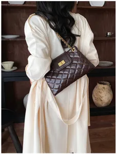 Chic quilted chain shoulder bag for women, stylish brown leather commuter handbag detail view.