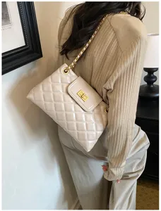 Chic quilted chain shoulder bag for women, elegant commuter handbag with metal turn lock.