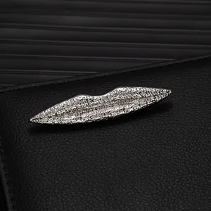 Detailed view of the exquisite silver alloy lip brooch, perfect for high-end suit lapel pins.
