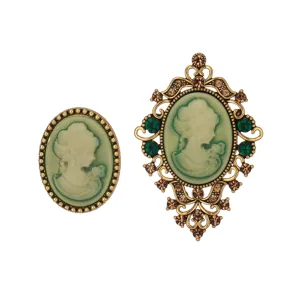 Vintage cameo brooch set featuring elegant lady profile with ornate gold frame and green stones.