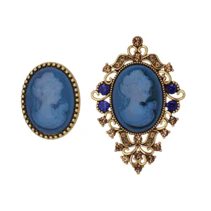 Vintage blue cameo portrait brooch and matching accessory set, detailed gold-tone filigree.