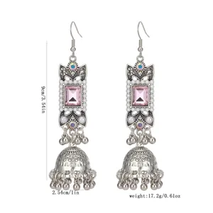 Vintage ethnic long jhumka earrings with pink square stone, pearl accents and bell tassels.