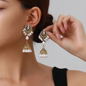 Vintage ethnic style pearl rhinestone drop earrings, elegant hollow design with details.