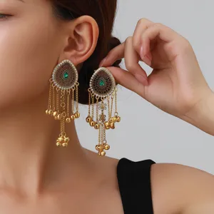 Elegant long tassel earrings featuring teardrop design with green stones and gold chains for women.
