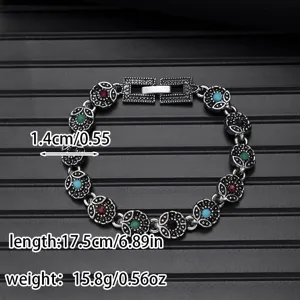 Vintage silver tone multi-stone mosaic chain bracelet detail view showing intricate metalwork.