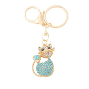 Cute crystal cat keychain with blue rhinestones and gold metal ring for bags and keys.