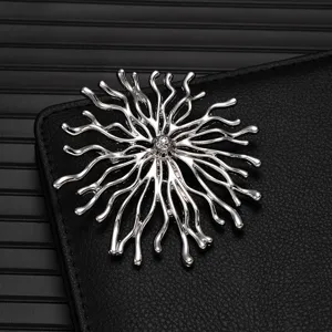 Exquisite silver alloy brooch detail shot, high-end design fashion suit lapel pin badge.