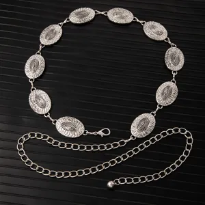 Detailed close-up of retro silver metal waist chain with elegant engraved oval links.