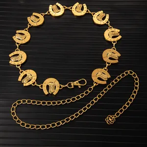 Detailed shot of retro gold metal waist chain with horseshoe and cowboy boot link charms.