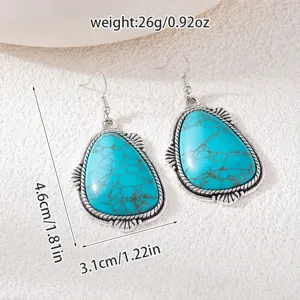 Vintage bohemian turquoise drop earrings with silver metal frame, chic ethnic jewelry for women.