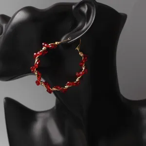 Detailed view of European style red crystal wrapped hoop earrings, fashion women jewelry.
