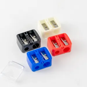 Detail view of colorful double-hole pencil sharpeners with clear covers, ideal makeup tool.