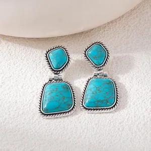 Bohemian turquoise drop earrings, vintage silver detailed double stone drop detail design closeup