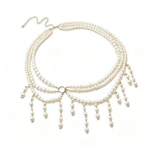 Elegant multi-layer pearl waist chain with tassel fringe, retro Y2K fashion body jewelry.