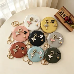 Ronde draagbare make-up spiegel sleutelhanger met ballerine hanger, dubbelzijdige zakspiegel.