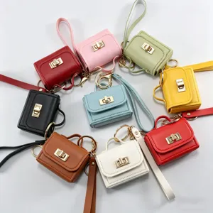 Mini étui écouteurs en cuir multicolore porte-monnaie porte-clés avec fermoir tournant.