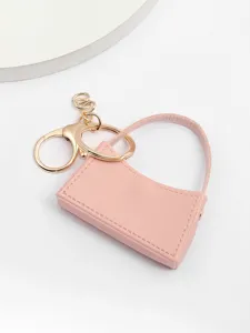 Joli porte-clés mini sac à main rose en cuir PU pour clés de voiture et accessoire de mode.