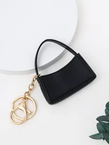 Mini porte-clés sac à main en cuir PU noir avec chaîne dorée, pendentif de sac chic pour clés.