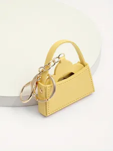 Leuke gele lederen mini handtas sleutelhanger met goudkleurige hardware, creatief cadeau.