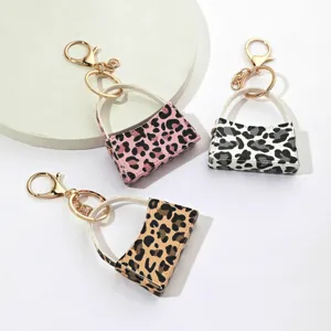 Porte-clés Mini Sac Courbé Imprimé Léopard en Cuir PU Porte-monnaie Mignon Chaîne de Clés Voiture Sac Suspendu Ornement Accessoires