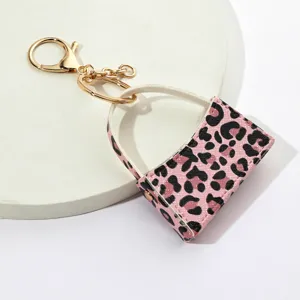 Porte-clés mini sac à main motif léopard rose, accessoire mignon en cuir PU pour sac de voiture.