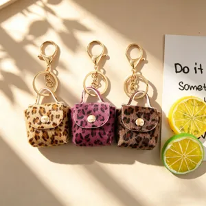 Retro luipaardprint pluche mini portemonnee sleutelhanger, schattige fluffy tas hanger goud.