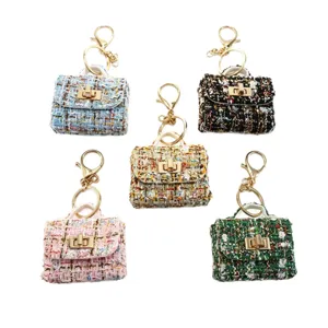 Chique tweed mini handtas sleutelhanger, elegante lederen patchwork etui voor oortjes.