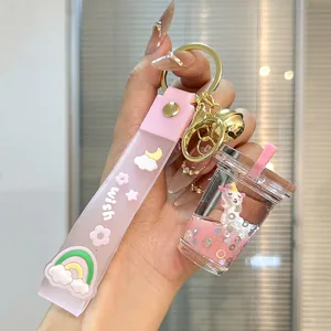 Cute cartoon liquid quicksand milk tea bottle keychain with pink strap sweet schoolbag pendant