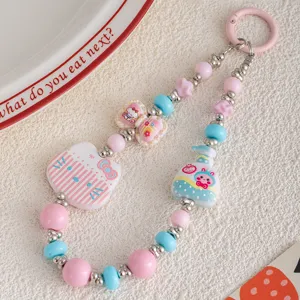 Cute cat beaded phone chain detail, pink and blue charms, aesthetic keychain pendant accessory.