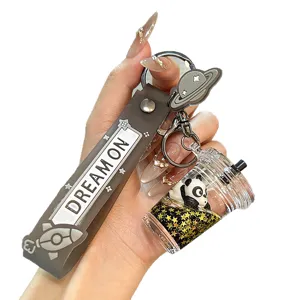 Cute cartoon oil-filled liquid panda keychain creative school bag pendant for women.