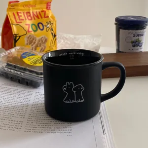 Matte black ceramic coffee mug with cute cartoon animal print and drink more water text 320ml