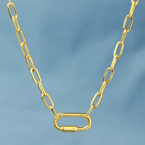 Gold paperclip chain necklace detail view, geometric link pendant fashion jewelry accessory.