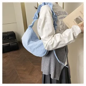 Casual light blue gathered shoulder bag, stylish dumpling tote for daily commute and travel.