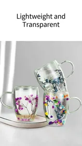 Double wall glass cup with dried flowers inside, beautiful transparent coffee mug gift detail.
