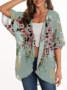 Detail view of floral chiffon kimono cardigan, lightweight sun protection summer beach cover up.