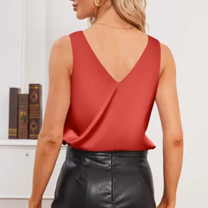 Detail view of a red satin V-neck sleeveless tank top worn by a model from the back.