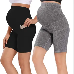 High waist maternity yoga shorts with pockets for pregnant women. Comfortable activewear.